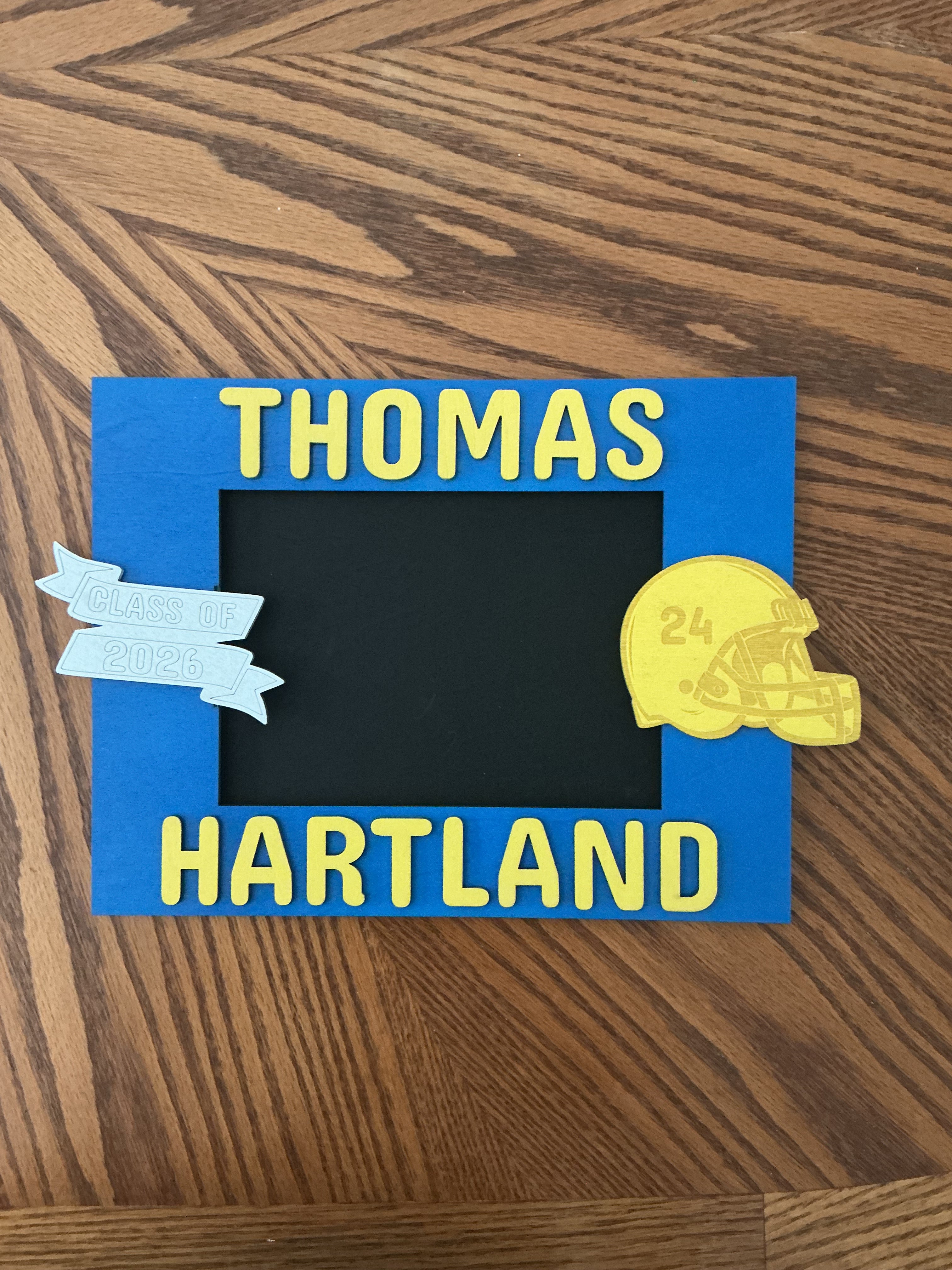 Blue football frame (Thomas/Hartland) → "Blue and yellow painted wood laser engraved football picture frame with Class of banner"