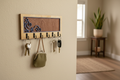 Celestial moon laser cut wood key hanger with 7 hooks mounted in entryway lifestyle photo