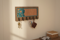 Hummingbird laser cut wood key hanger with 6 hooks mounted in entryway lifestyle photo