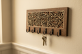 Vine and leaf laser cut wood key hanger with 6 hooks mounted in entryway lifestyle photo