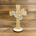 Laser Engraved Wood Cross The Dove of Peace with stand leaning right on rustic wood surface