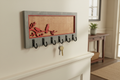 Cardinal laser cut wood key hanger with 6 hooks mounted in entryway lifestyle photo
