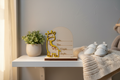 Personalized wooden baby birth announcement sign with yellow giraffe design displayed in a soft nursery setting