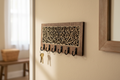Lotus blossom laser cut wood key hanger with 6 hooks mounted in entryway lifestyle photo